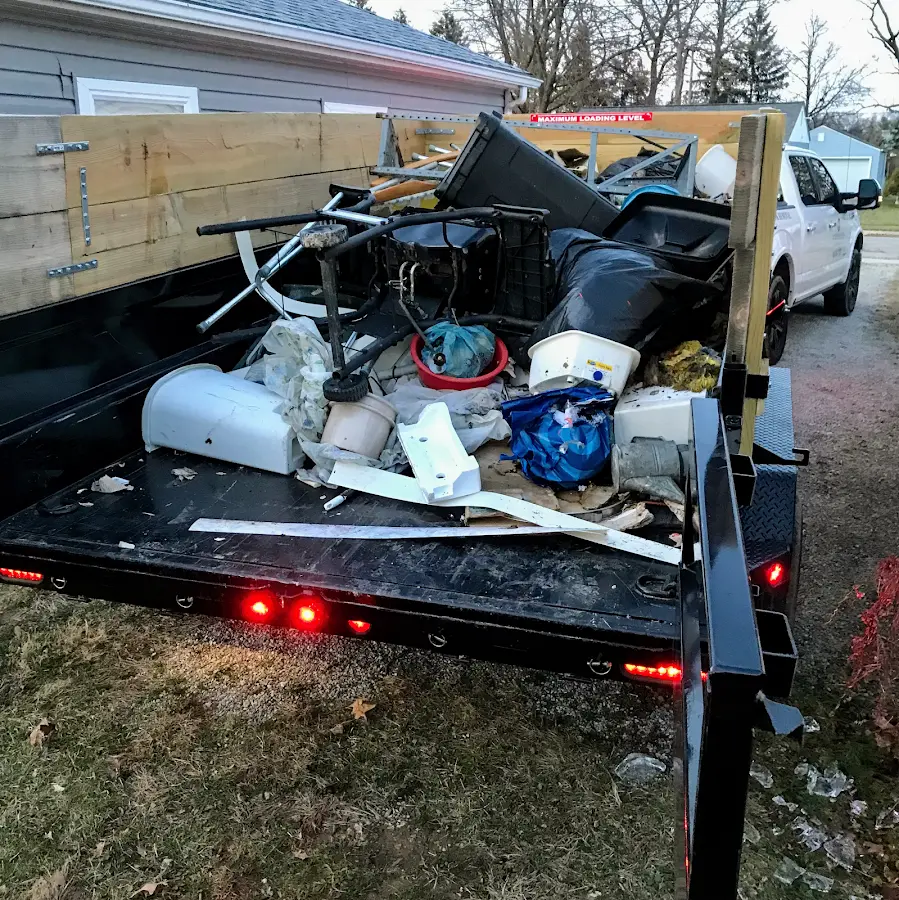 Roll-off dumpster delivered to a residential driveway in Catalina
